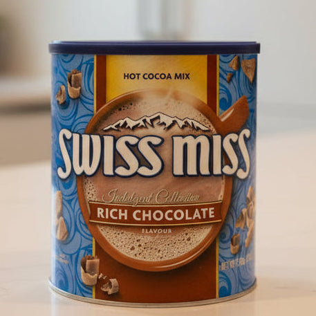 Can of Swiss Miss hot cocoa mix on a kitchen counter