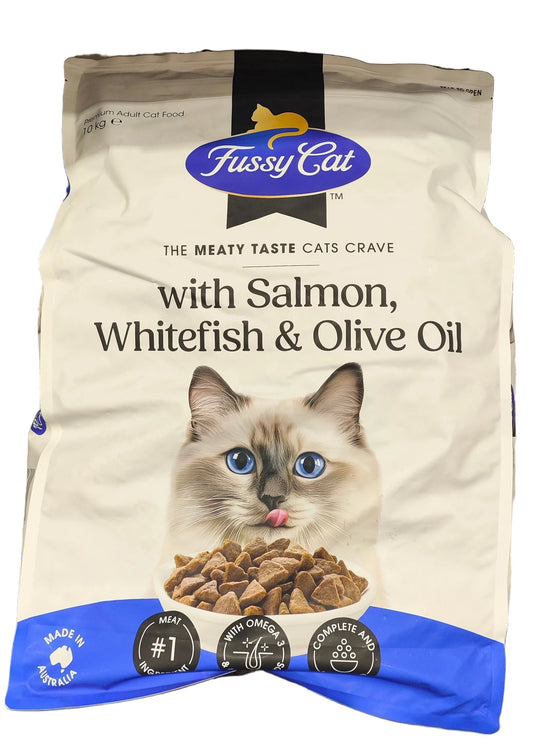 Fussy Cat cat food package with salmon, whitefish, and olive oil on a shelf.